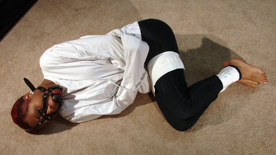 Nykisha-BGBv19 - Blindfolded and Gagged in Straitjacket, Tape Tied Barefoot